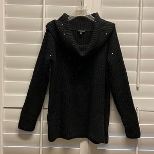 Black cowl neck knit sweater covered in dazzling sequins